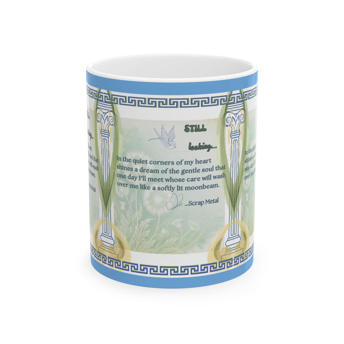 A ceramic mug with a white base featuring a design that includes a poem, a butterfly, and floral elements against a green and blue background.
